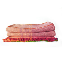 Load image into Gallery viewer, Folded colorful patterned blanket on a white background