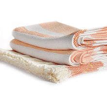Load image into Gallery viewer, Side view of a folded striped blanket with orange and white pattern on a white background.