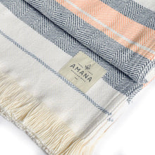 Load image into Gallery viewer, Up close view of Escape Throw Blanket with Amana patch.