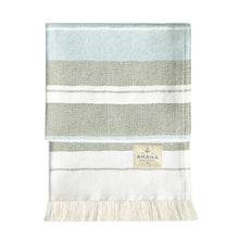 Load image into Gallery viewer, Striped blanket with fringes and Amana label on a white background