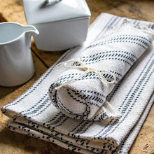 Load image into Gallery viewer, navy Vintage Ticking Tea Towel &amp; Dish Cloth Set on a table with cup
