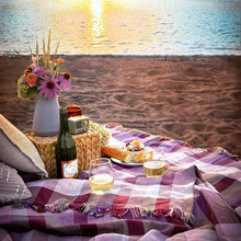 Load image into Gallery viewer, Magenta Prism Cotton Throw Blanket on a beach at sunset with picnic food and drink

