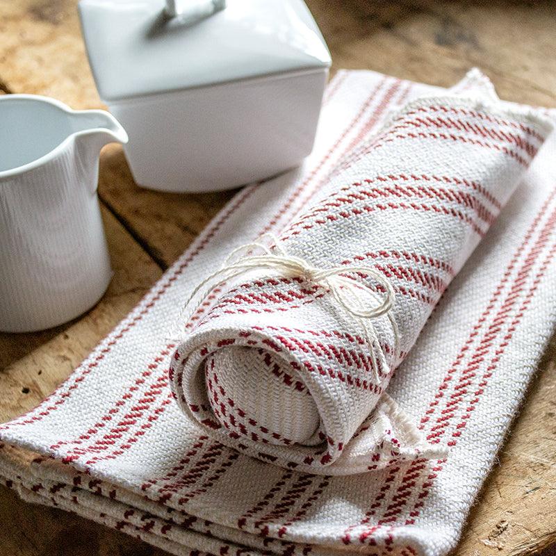 burgundy Vintage Ticking Tea Towel & Dish Cloth Set on a table with cups