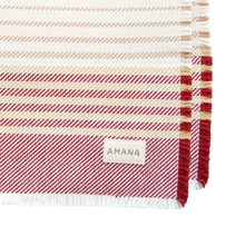 Load image into Gallery viewer, corner of burgundy/tan contempo placemat with Amana label
